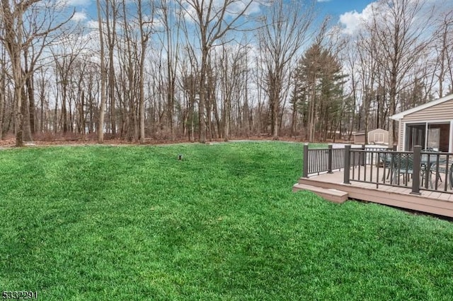 view of yard with a deck