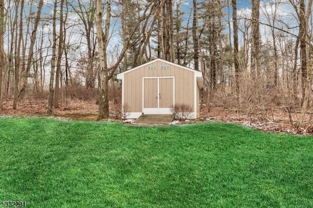 view of outbuilding featuring a yard