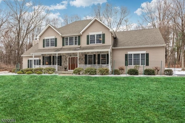 view of front facade with a porch and a front lawn