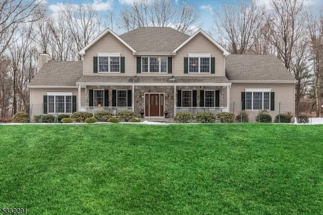 view of property with a porch and a front lawn