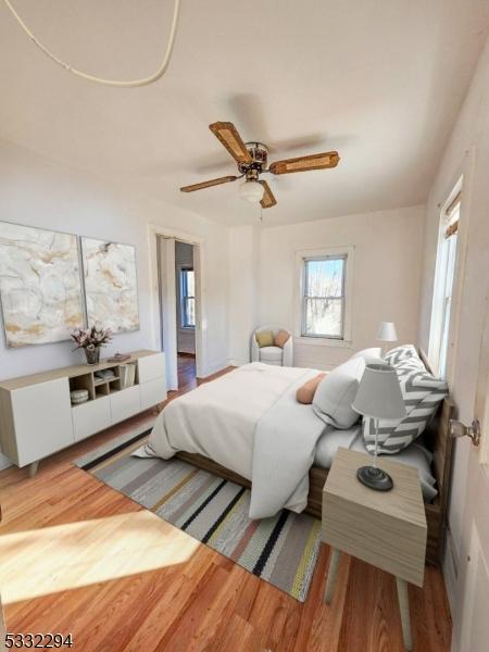 bedroom featuring hardwood / wood-style floors and ceiling fan