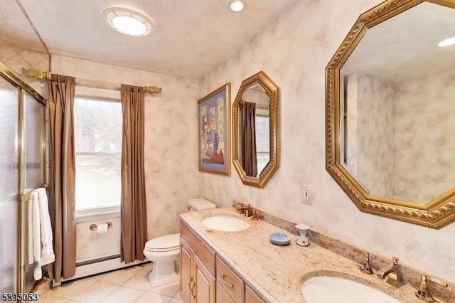 bathroom with tile patterned flooring, vanity, a healthy amount of sunlight, and a baseboard radiator