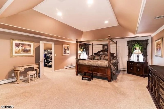 carpeted bedroom with a walk in closet, ornamental molding, and a baseboard heating unit