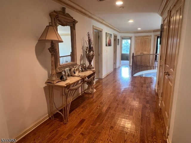 hall featuring dark hardwood / wood-style floors and crown molding