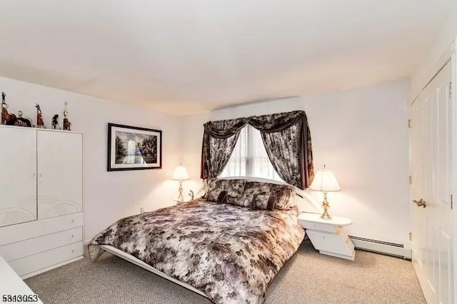 carpeted bedroom with a baseboard radiator