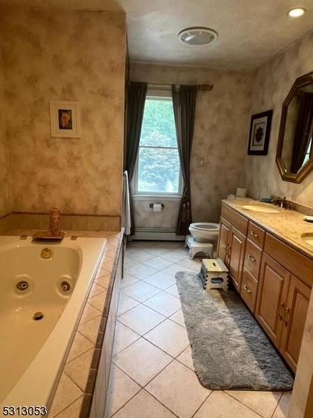 bathroom featuring tile patterned flooring, a baseboard heating unit, tiled bath, toilet, and vanity