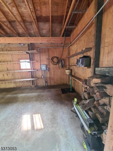 garage featuring wooden walls