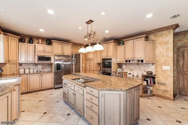 kitchen featuring pendant lighting, a center island, light stone counters, and stainless steel appliances