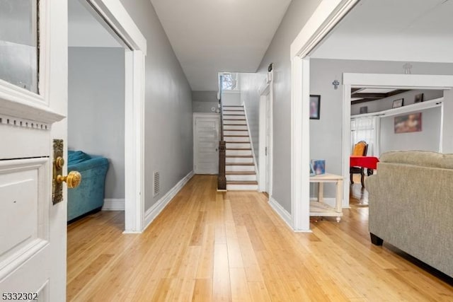 staircase featuring hardwood / wood-style floors