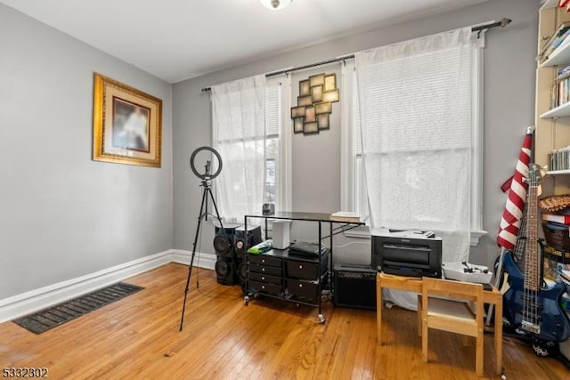 home office featuring hardwood / wood-style floors