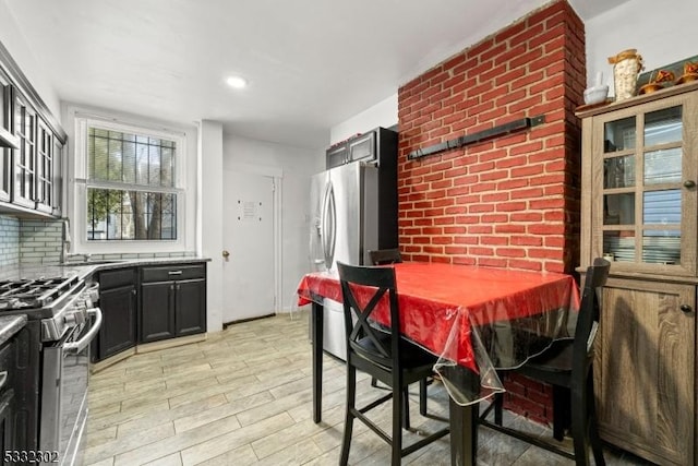 kitchen featuring backsplash and appliances with stainless steel finishes