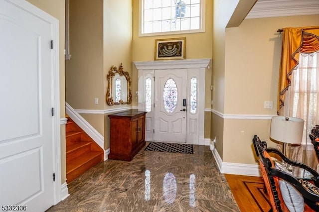 entrance foyer featuring crown molding