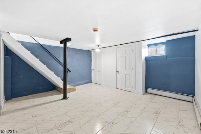 basement featuring a baseboard heating unit