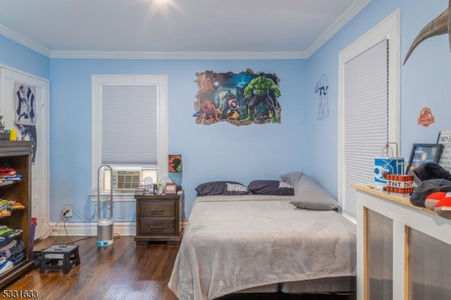 bedroom with cooling unit, dark hardwood / wood-style flooring, and ornamental molding