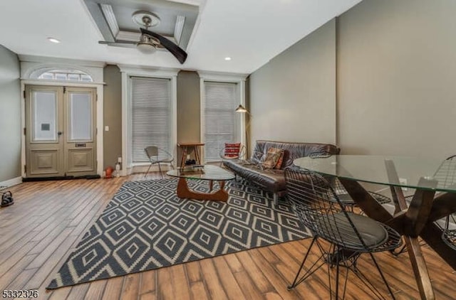 sitting room with wood-type flooring and ceiling fan