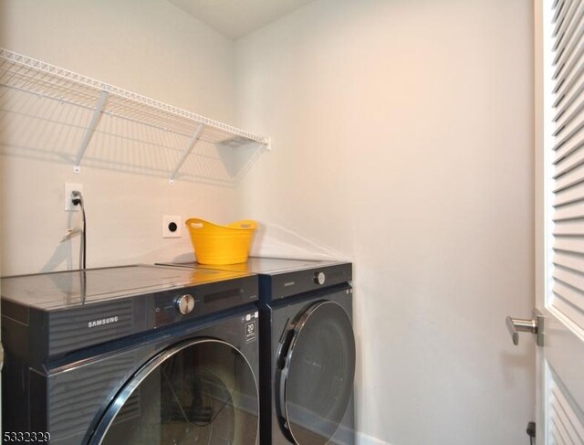 washroom featuring washer and dryer