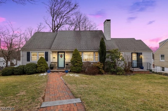 view of front of property with a lawn