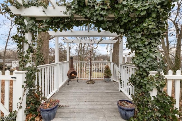 wooden terrace with a pergola