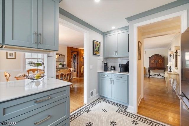 kitchen with tasteful backsplash and light tile patterned floors