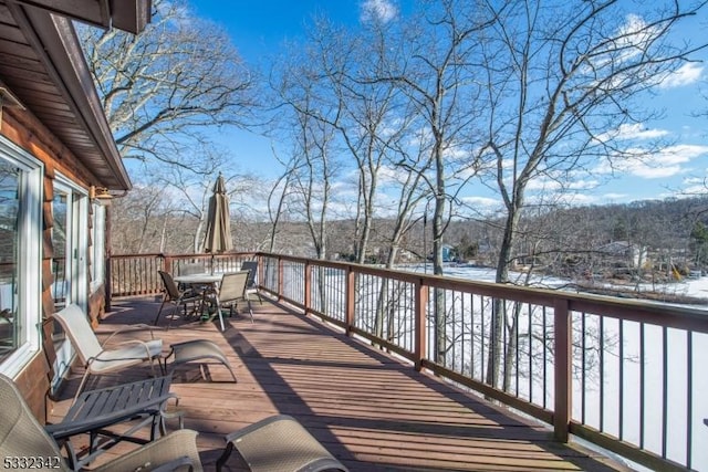 view of snow covered deck