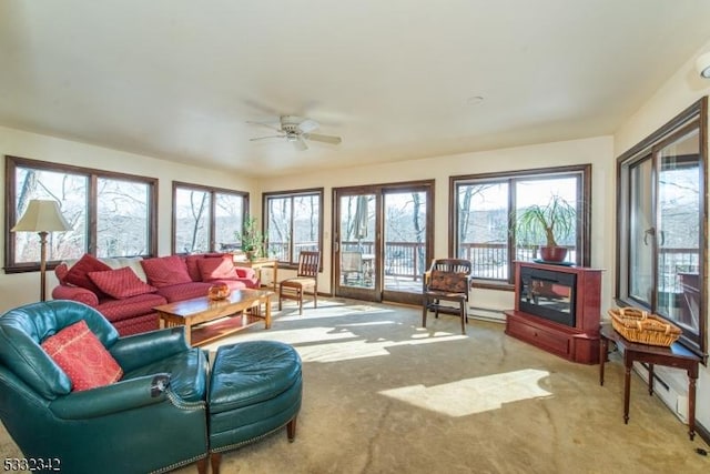 sunroom featuring ceiling fan