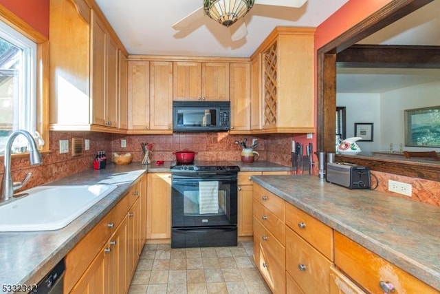 kitchen featuring ceiling fan, sink, backsplash, and black appliances