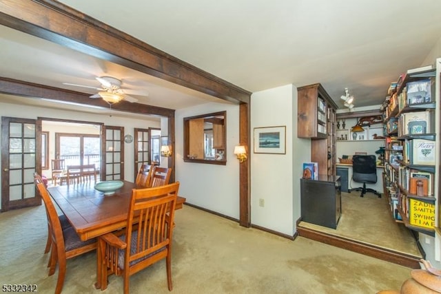 carpeted dining area featuring ceiling fan and french doors