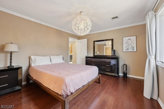 bedroom with dark hardwood / wood-style flooring, crown molding, and a chandelier