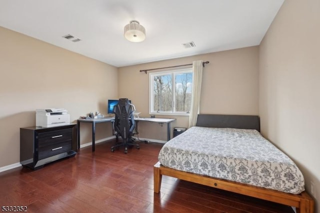 bedroom featuring dark hardwood / wood-style flooring