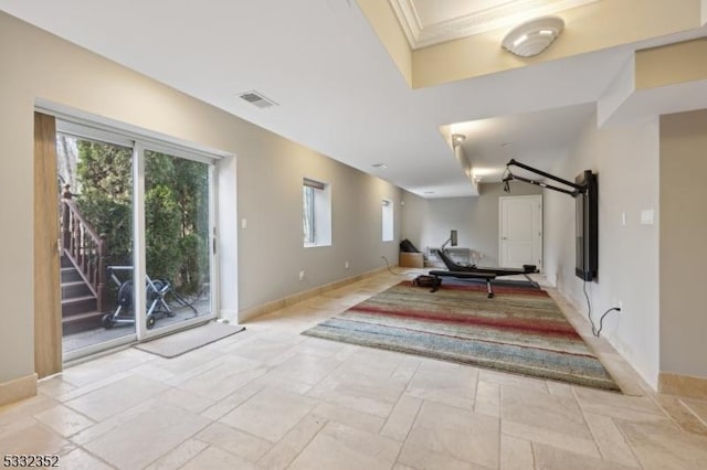 exercise room featuring ornamental molding