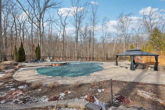 view of swimming pool featuring a gazebo and a patio