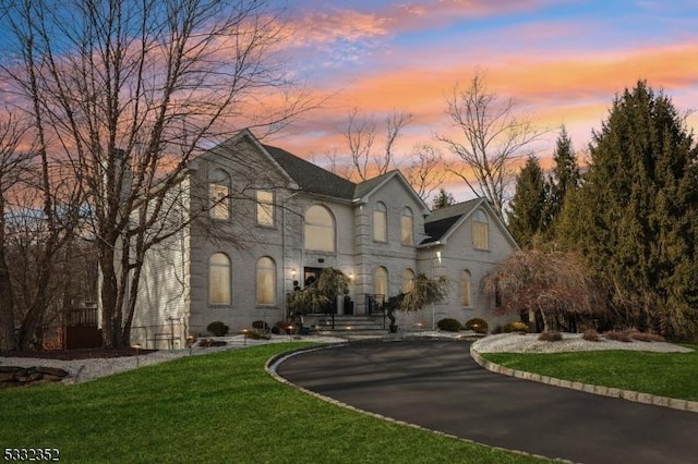 view of front of property with a lawn