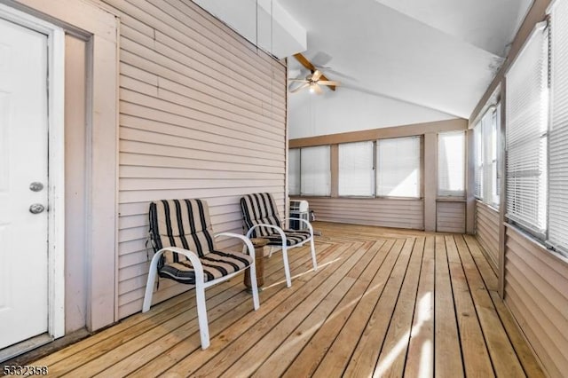 sunroom / solarium featuring lofted ceiling and ceiling fan