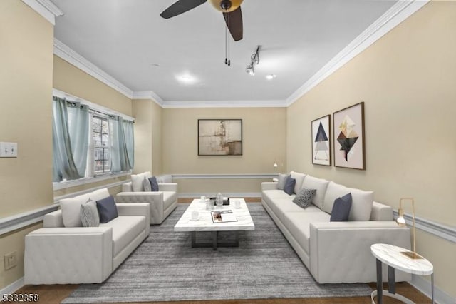 living room with ceiling fan and ornamental molding