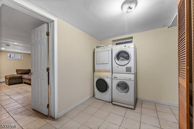 laundry area with stacked washer / dryer