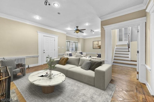 living room featuring ceiling fan, parquet floors, and crown molding