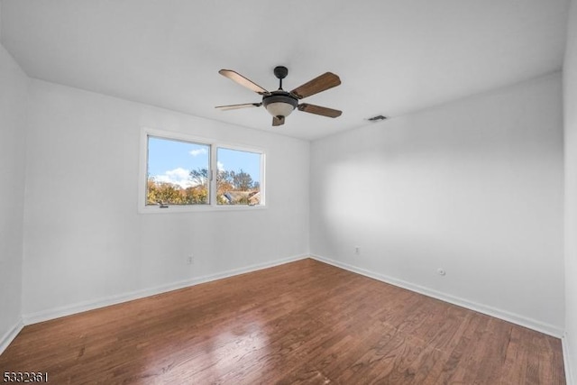 empty room with ceiling fan and wood-type flooring