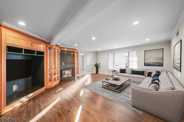 living room with ornamental molding and hardwood / wood-style floors