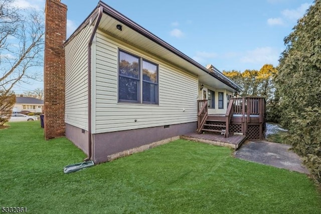 view of property exterior featuring a lawn and a wooden deck