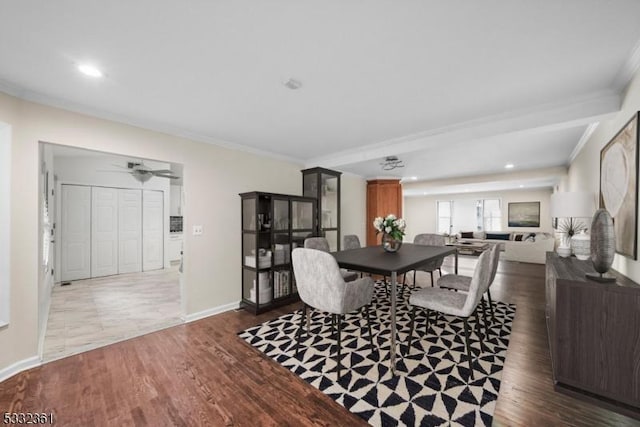 dining space featuring ceiling fan, ornamental molding, and dark hardwood / wood-style floors