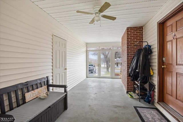 interior space with french doors and ceiling fan