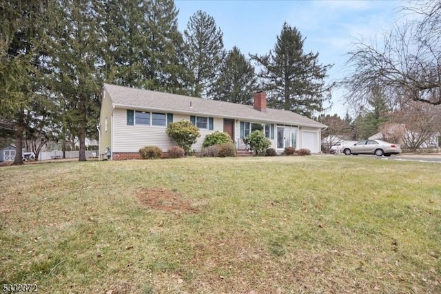 ranch-style home with a front yard and a garage