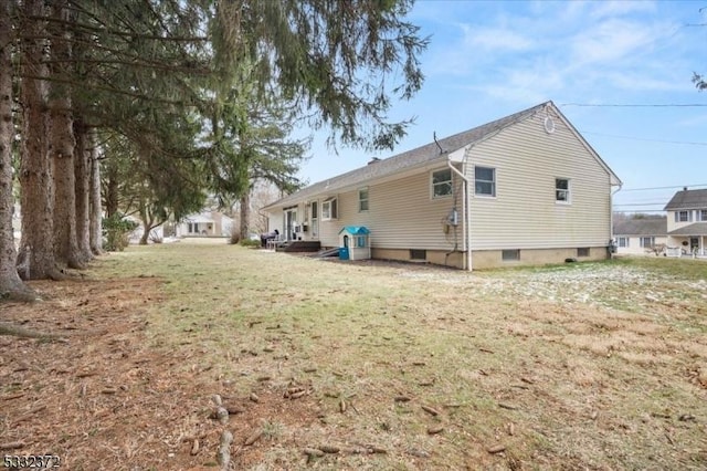 view of property exterior featuring a lawn