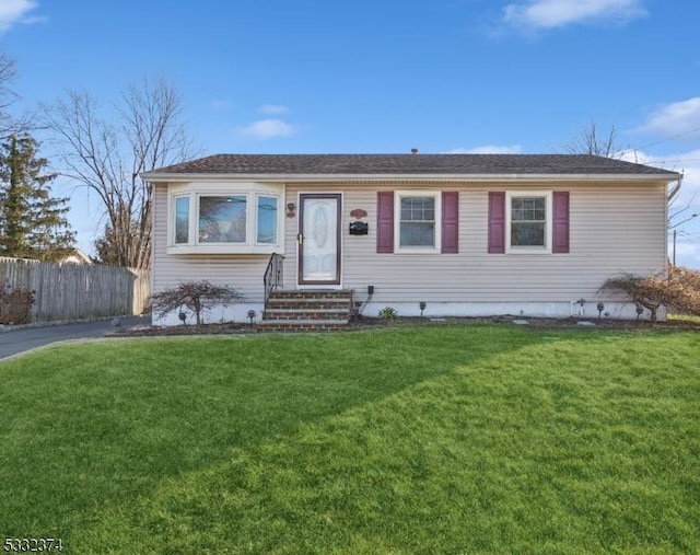 ranch-style house with a front yard