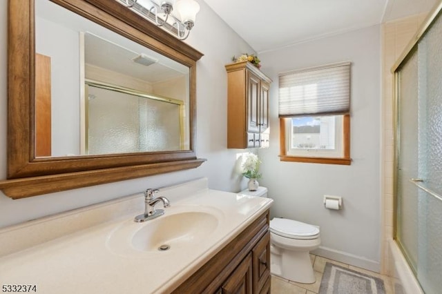 full bathroom with combined bath / shower with glass door, tile patterned flooring, vanity, and toilet