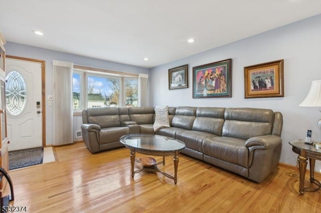 living room with light hardwood / wood-style floors