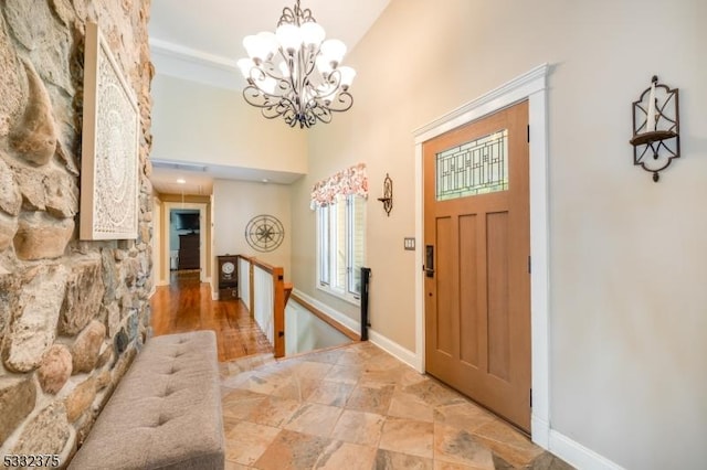 entrance foyer featuring an inviting chandelier