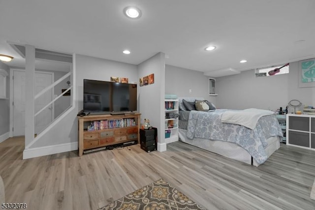 bedroom with light wood-type flooring