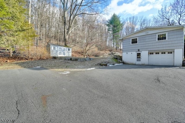 view of side of property with a garage