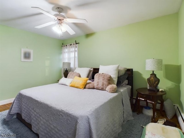 bedroom featuring ceiling fan and hardwood / wood-style flooring